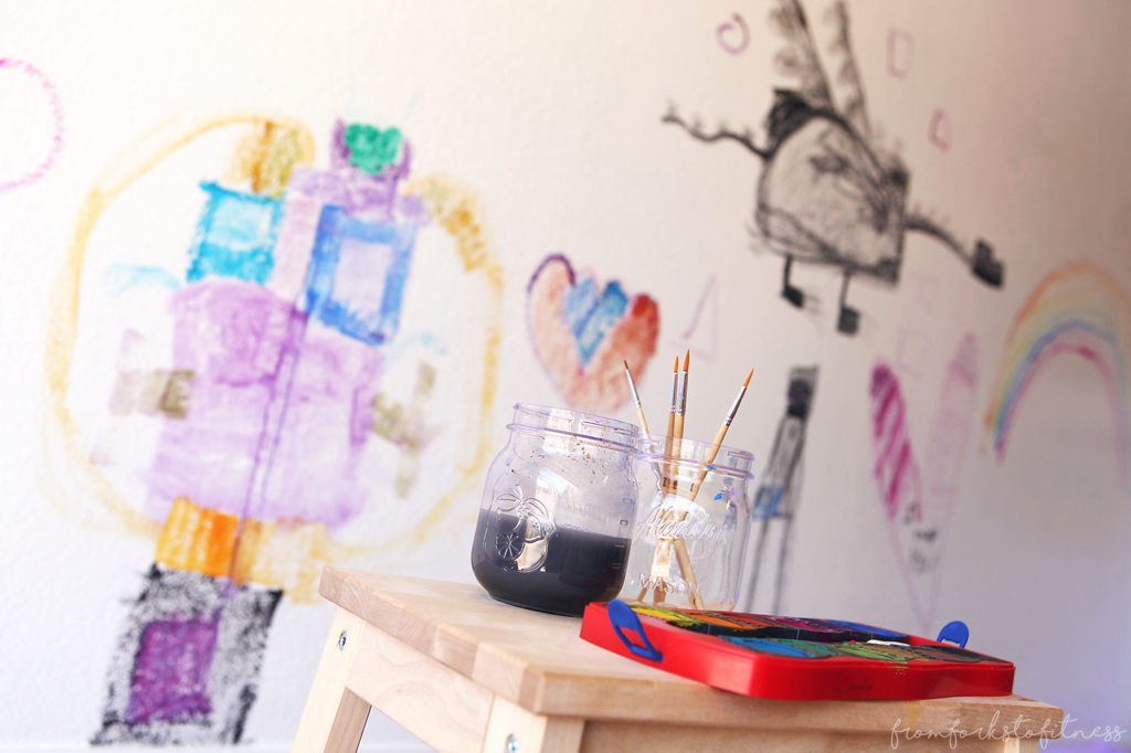 Have piles and piles of kids' doodles and artwork? This kids art wall might be the answer for you. #montessori #homeschool #kids #painting #ideas #display #decor
